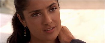 Movie still from “After the Sunset” (2004), directed by Brett Ratner – A woman's face with a smile on her face; Close Up shot, Over the shoulder angle