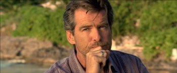 Movie still from “After the Sunset” (2004), directed by Brett Ratner – A person wearing a ring; Close Up shot, Over the shoulder angle