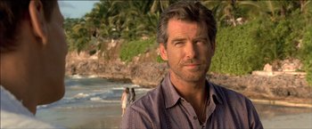 Movie still from “After the Sunset” (2004), directed by Brett Ratner – A person standing on a beach; Close Up shot, Over the shoulder angle