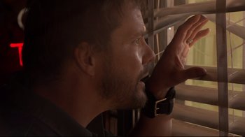Movie still from “Agents of S.H.I.E.L.D.” (2013), created by Joss Whedon – A person looking out of a window; Close Up shot, Low angle