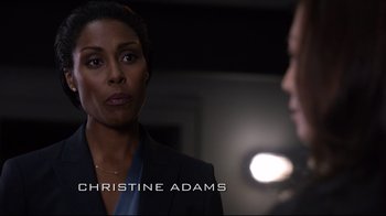 Movie still from “Agents of S.H.I.E.L.D.” (2013), created by Joss Whedon – A woman in a black jacket and a man in a black suit; Close Up shot, Over the shoulder angle