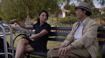 Movie still from “Agents of S.H.I.E.L.D.” (2013), created by Joss Whedon – Two people sitting on a bench in a park; Medium shot, Over the shoulder angle