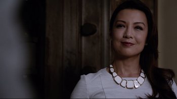 Movie still from “Agents of S.H.I.E.L.D.” (2013), created by Joss Whedon – A person wearing a necklace; Close Up shot, Low angle