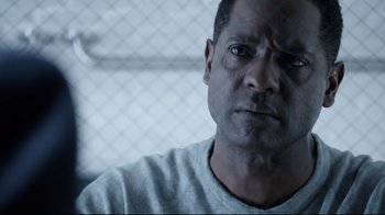 Movie still from “Agents of S.H.I.E.L.D.” (2013), created by Joss Whedon – A person in a prison cell; Close Up shot, Over the shoulder angle