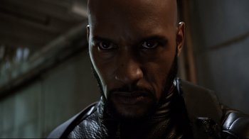 Movie still from “Agents of S.H.I.E.L.D.” (2013), created by Joss Whedon – A person wearing a leather jacket; Close Up shot, Low angle