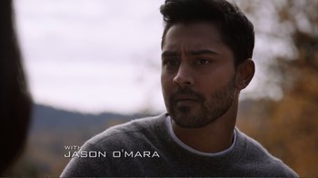 Movie still from “Agents of S.H.I.E.L.D.” (2013), created by Joss Whedon – A person wearing a sweater; Close Up shot, Over the shoulder angle
