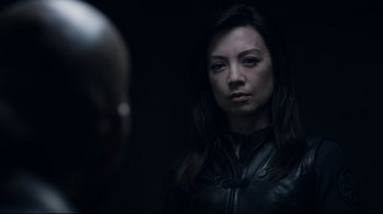 Movie still from “Agents of S.H.I.E.L.D.” (2013), created by Joss Whedon – A woman in a leather jacket looking at a man in a leather jacket; Close Up shot, Over the shoulder angle