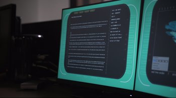 Movie still from “Agents of S.H.I.E.L.D.” (2013), created by Joss Whedon – A computer screen with a computer code on it; Extreme Close Up shot, Over the shoulder angle