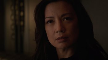 Movie still from “Agents of S.H.I.E.L.D.” (2013), created by Joss Whedon – A person with long dark hair; Close Up shot, Over the shoulder angle