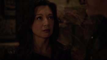 Movie still from “Agents of S.H.I.E.L.D.” (2013), created by Joss Whedon – A person looking at the camera; Close Up shot, Over the shoulder angle