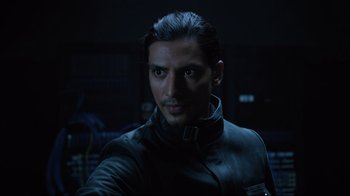 Movie still from “Agents of S.H.I.E.L.D.” (2013), created by Joss Whedon – A person wearing a leather jacket; Close Up shot, Over the shoulder angle