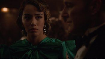 Movie still from “Agents of S.H.I.E.L.D.” (2013), created by Joss Whedon – A person wearing a green dress; Close Up shot, Over the shoulder angle