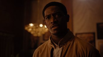 Movie still from “Snowfall” (2017), directed by Hiro Murai – A person wearing a jacket; Close Up shot, Low angle