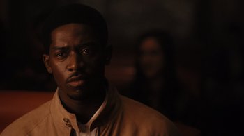 Movie still from “Snowfall” (2017), directed by Hiro Murai – A person wearing a jacket; Close Up shot, Over the shoulder angle