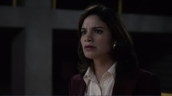 Movie still from “Agents of S.H.I.E.L.D.” (2013), created by Joss Whedon – A woman in a white shirt and a red jacket; Close Up shot, Over the shoulder angle