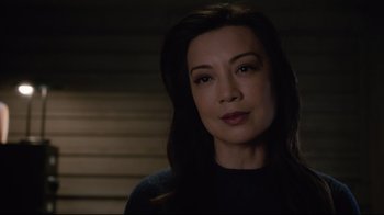 Movie still from “Agents of S.H.I.E.L.D.” (2013), created by Joss Whedon – A person with long dark hair; Close Up shot, Over the shoulder angle