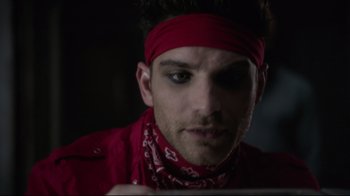 Movie still from “Agents of S.H.I.E.L.D.” (2013), created by Joss Whedon – A person wearing a red bandanna; Close Up shot, Over the shoulder angle