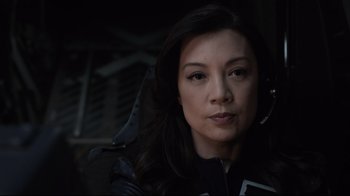 Movie still from “Agents of S.H.I.E.L.D.” (2013), created by Joss Whedon – A person wearing a black jacket; Close Up shot, Over the shoulder angle