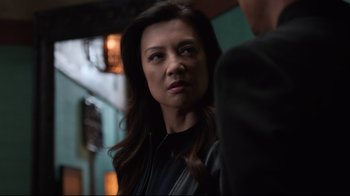 Movie still from “Agents of S.H.I.E.L.D.” (2013), created by Joss Whedon – A person with long hair; Close Up shot, Over the shoulder angle