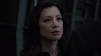 Movie still from “Agents of S.H.I.E.L.D.” (2013), created by Joss Whedon – A person with long dark hair; Close Up shot, Over the shoulder angle