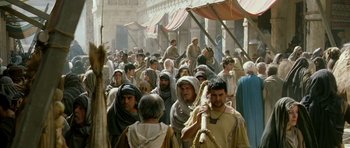 Movie still from “Agora” (2009), directed by Alejandro Amenábar – A crowd of people walking down a street; Wide shot, High angle