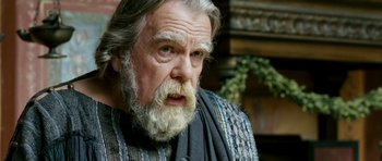 Movie still from “Agora” (2009), directed by Alejandro Amenábar – An old man with a beard and a mustache; Close Up shot, Over the shoulder angle