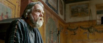 Movie still from “Agora” (2009), directed by Alejandro Amenábar – An old man with a beard and a long white beard looking to his left; Close Up shot, Low angle