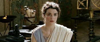 Movie still from “Agora” (2009), directed by Alejandro Amenábar – A woman in a greek dress looking at the camera; Close Up shot, Over the shoulder angle