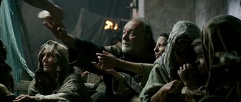 Movie still from “Agora” (2009), directed by Alejandro Amenábar – An older man and woman sitting on a couch; Medium shot, Low angle