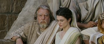 Movie still from “Agora” (2009), directed by Alejandro Amenábar – An older man and a young woman are standing next to each other; Close Up shot, Low angle