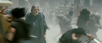Movie still from “Agora” (2009), directed by Alejandro Amenábar – An old man is walking through the fog; Wide shot, Over the shoulder angle