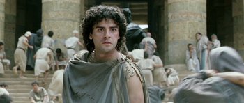 Movie still from “Agora” (2009), directed by Alejandro Amenábar – A man with a beard is standing in front of a group of people; Close Up shot, Low angle