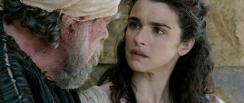 Movie still from “Agora” (2009), directed by Alejandro Amenábar – An old man and a young woman looking at each other; Close Up shot, Over the shoulder angle