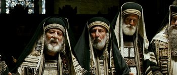 Movie still from “Agora” (2009), directed by Alejandro Amenábar – A group of men in traditional clothing are posing for a picture; Close Up shot, Low angle