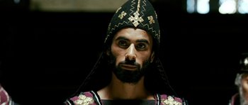 Movie still from “Agora” (2009), directed by Alejandro Amenábar – A man with a beard wearing a black and gold headpiece; Close Up shot, Low angle