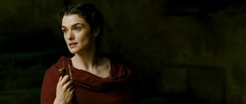 Movie still from “Agora” (2009), directed by Alejandro Amenábar – A woman in a red dress is looking at the camera; Close Up shot, Over the shoulder angle