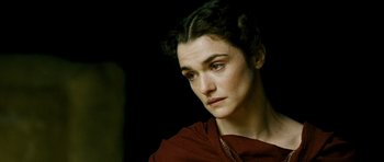 Movie still from “Agora” (2009), directed by Alejandro Amenábar – A person wearing a red shirt; Close Up shot, Over the shoulder angle