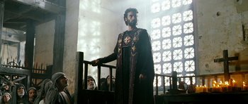 Movie still from “Agora” (2009), directed by Alejandro Amenábar – A man wearing a robe and a crown standing in front of a window; Medium shot, Low angle