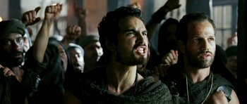 Movie still from “Agora” (2009), directed by Alejandro Amenábar – A person with his mouth wide open; Close Up shot, Low angle