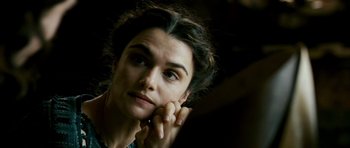 Movie still from “Agora” (2009), directed by Alejandro Amenábar – A person with her hand under her chin; Close Up shot, Over the shoulder angle