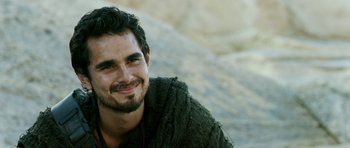 Movie still from “Agora” (2009), directed by Alejandro Amenábar – A person smiling for the camera; Close Up shot, Over the shoulder angle