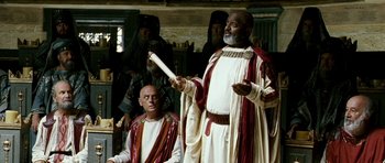 Movie still from “Agora” (2009), directed by Alejandro Amenábar – Two men in ancient roman garb holding a white stick; Medium shot, Over the shoulder angle