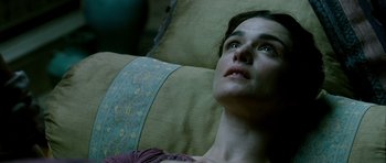 Movie still from “Agora” (2009), directed by Alejandro Amenábar – A person laying on a couch; Close Up shot, Overhead angle