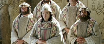 Movie still from “Agora” (2009), directed by Alejandro Amenábar – A group of men wearing robes and hats; Medium shot, Low angle