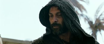 Movie still from “Agora” (2009), directed by Alejandro Amenábar – A man with a beard wearing a hooded shirt; Close Up shot, Low angle