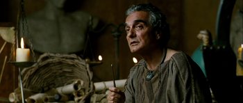 Movie still from “Agora” (2009), directed by Alejandro Amenábar – An older man is holding a stick in his hand; Close Up shot, High angle