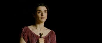 Movie still from “Agora” (2009), directed by Alejandro Amenábar – A woman holding a wooden stick in her hand; Close Up shot, High angle