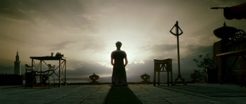 Movie still from “Agora” (2009), directed by Alejandro Amenábar – A man standing in front of a sunset; Extreme Wide shot, Low angle