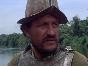 Movie still from “Aguirre, the Wrath of God” (1972), directed by Werner Herzog – A person wearing a hat; Close Up shot, Low angle