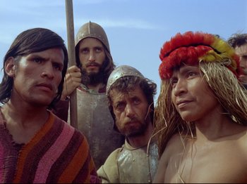 Movie still from “Aguirre, the Wrath of God” (1972), directed by Werner Herzog – A group of men standing next to each other; Close Up shot, Low angle